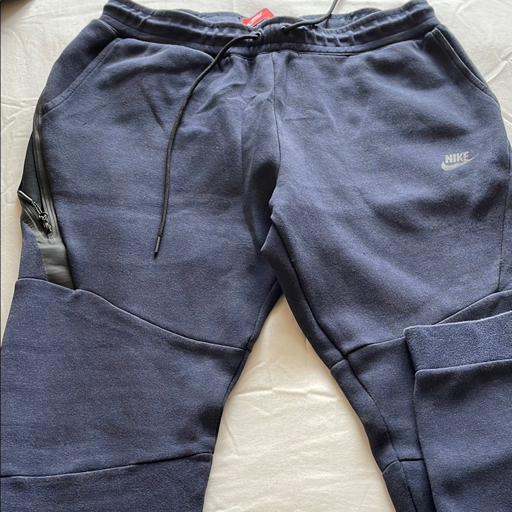 Nike Gray Sweatpants with Tapered Fit and Drawstring Waist